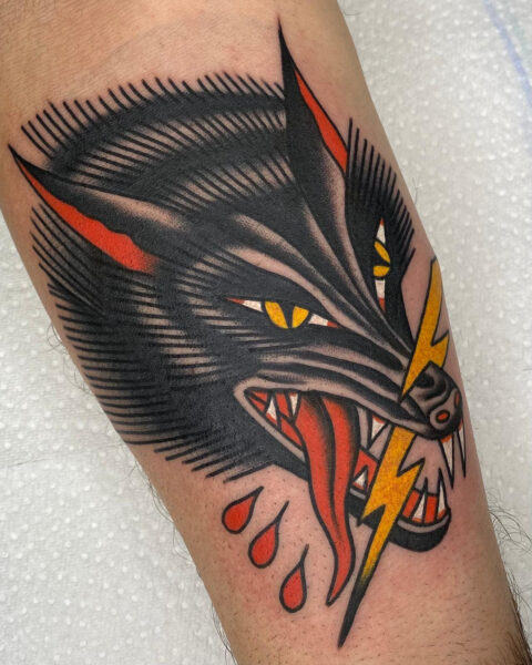 Traditional wolf tattoo by Michel Canale One Love Tattoo Prague